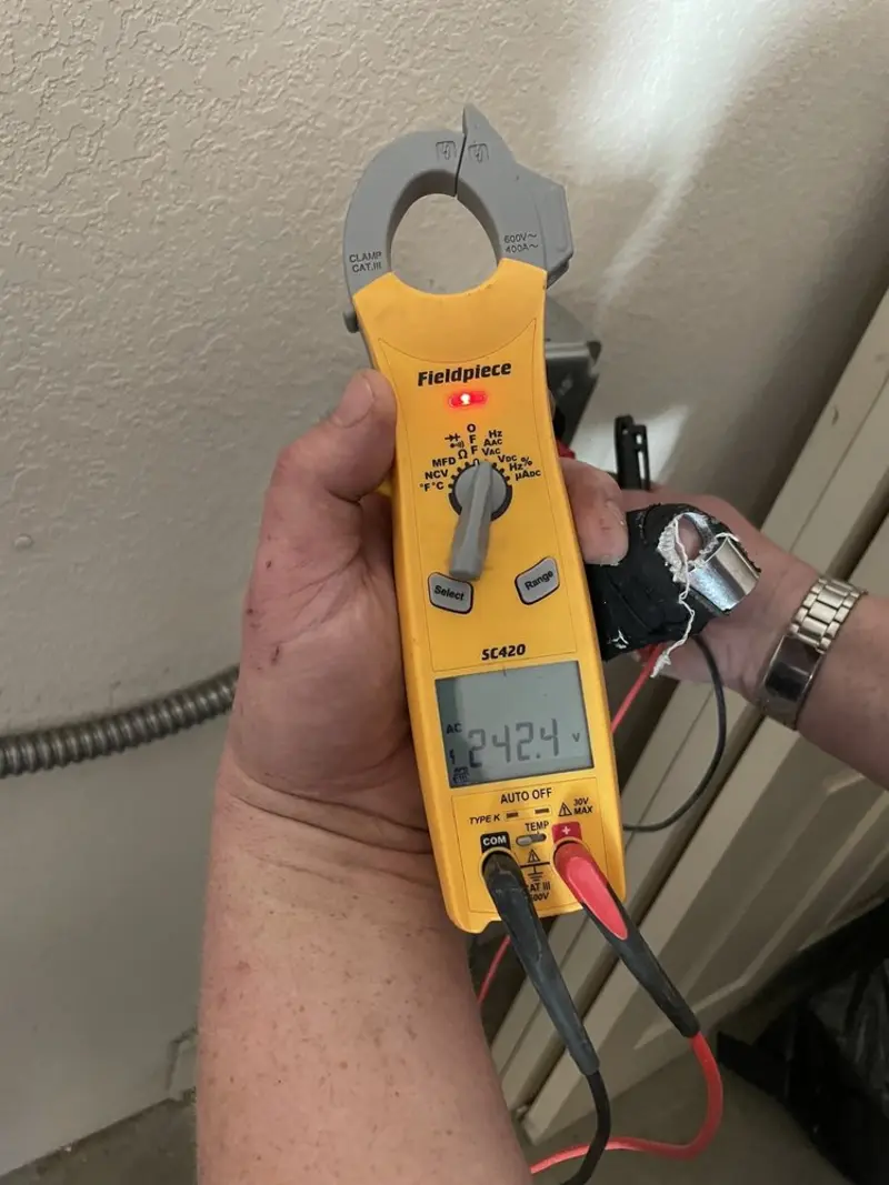 Voltage testing with clamp meter during Ceiling Fan Installation in West Brandywine